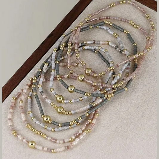 9 Pc. Multi‑Strand Metallic Accent Bracelet Stack