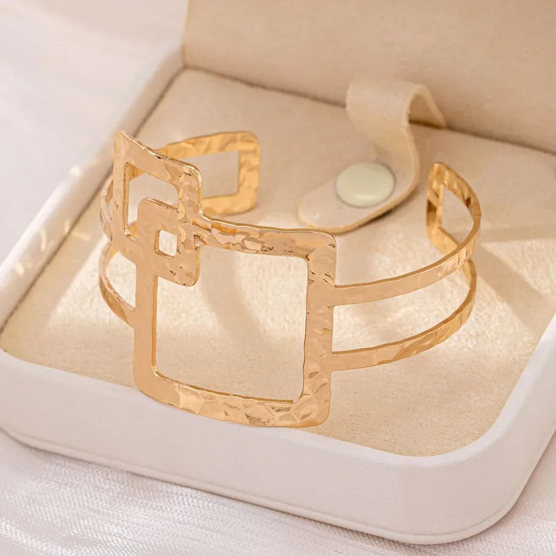 Golden Hammered Overlapping‑Square Bracelet