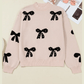 Ezlynn Apricot Pearl Embellished Bow Pattern Loose Sweater