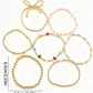 7 Pc. Stacked Golden Bow Bracelet Set