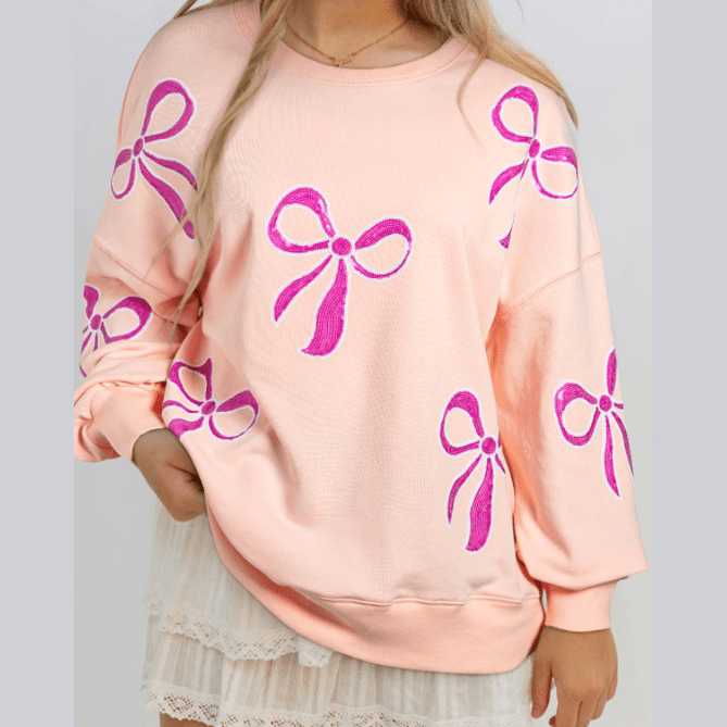 Thelma Apricot Pink Sequined Bowknot Drop Shoulder Oversized Sweatshirt