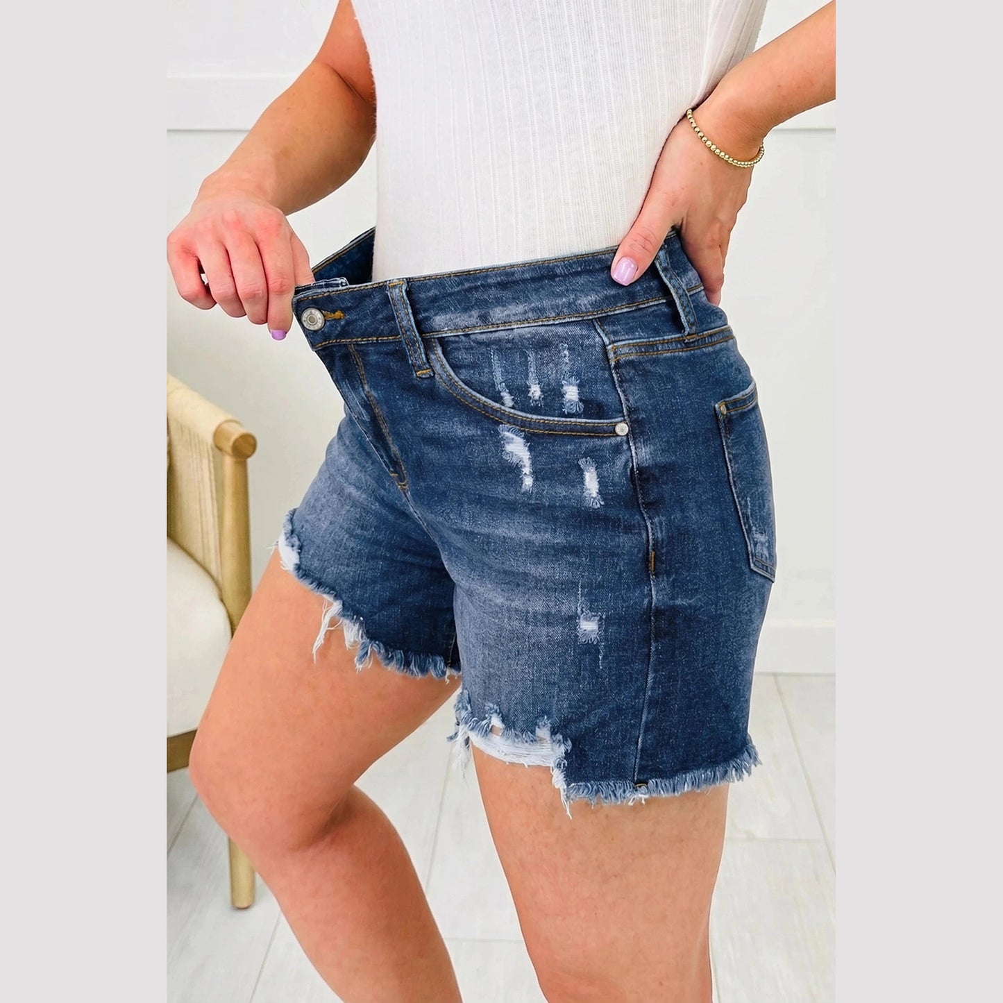 Alberta Dark Blue Asymmetric Raw Hem Distressed Whiskery Denim Shorts